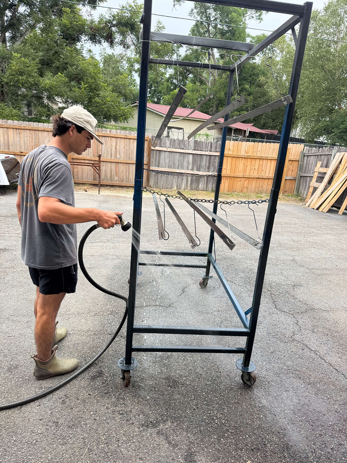 Rinsing parts on a rack.